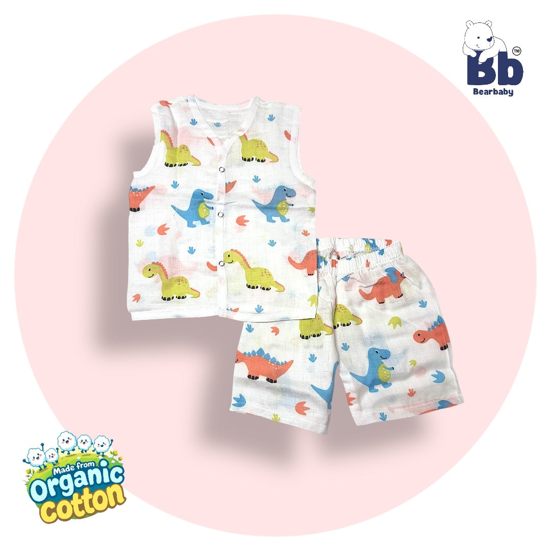 Sleeveless baby muslin jhabla and payjama set with a dino print, displayed against a pink background.